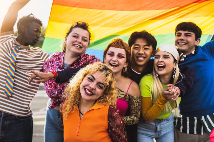 Happy diverse young friends celebrating gay pride festival - LGBTQ community concept