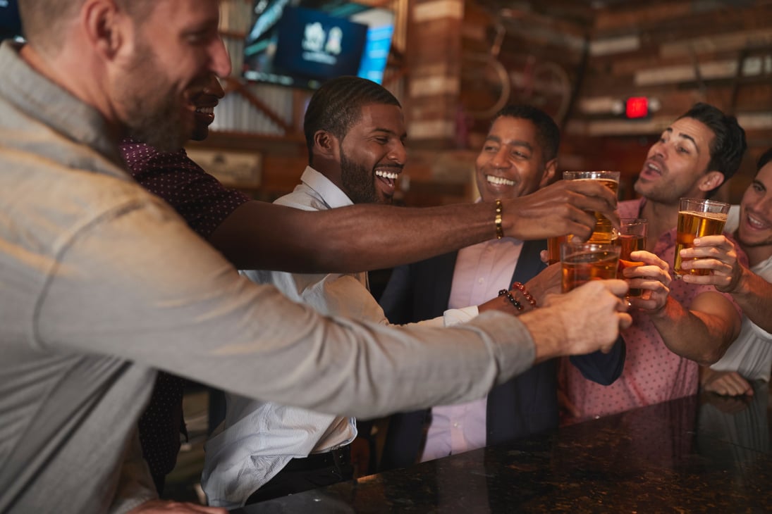 Group of Male Friends on Night Out for Bachelor Party in Bar Mak